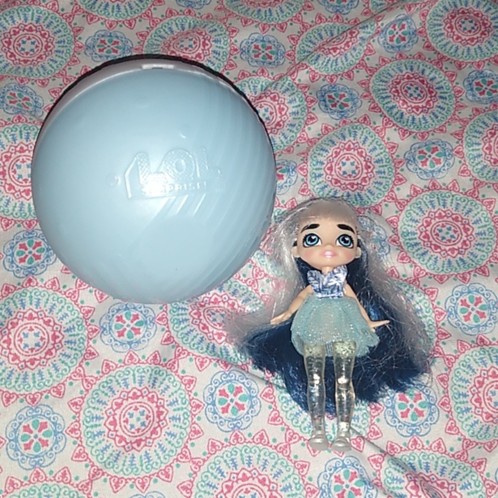 Hairmazing Small Doll with LOL blue and white ball.